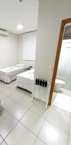 Postel nebo postele na pokoji v ubytování MFG Hotel