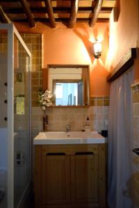 a bathroom with a sink and a mirror and a shower at Studio with wifi at Penaflor in Peñaflor