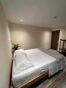 Postel nebo postele na pokoji v ubytování Casa Indigo Laureles-Estadio con Jacuzzi