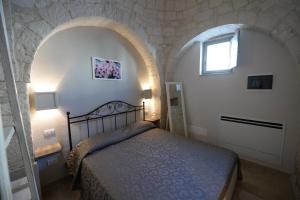 Postel nebo postele na pokoji v ubytování Trullo A Casedd