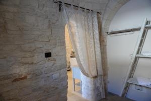 Koupelna v ubytování Trullo A Casedd + 11 fotografií