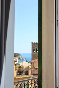 a view of the ocean from a window at Albergo Degli Amici in Monterosso al Mare