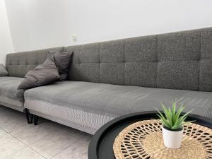 a living room with a couch with a table at Apartments Ana & Ita in Novalja