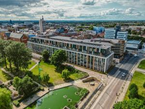 an aerial view of a building in a city at VICHY - The Glass House VIP Luxury Stay with gym, Cinema & Gaming Rooms, and Work space access in Hull