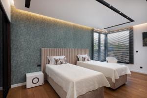 Posteľ alebo postele v izbe v ubytovaní Villa Excellence + 37 fotografií