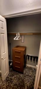 a room with a closet with a wooden dresser in it at WorldMark Rancho Vistoso in Oro Valley