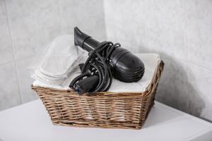 a basket with a hair dryer sitting on a table at Thanos Luxury home in Volos