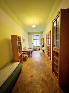 a bedroom with a bed and a living room at Old Town Rooms Wielopole in Krakow