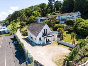 an aerial view of a white house at Baywatch Sands in Wadebridge