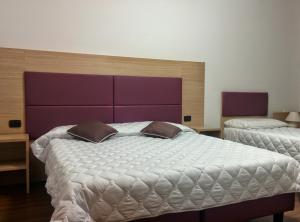 Cama o camas de una habitación en Hotel Esperanza