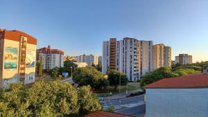 a view of a city with tall buildings and a street at Vile Park Apartments Pula in Pula
