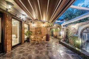 an indoor patio with a table and chairs at Jeonju Hanok Village, Maison14 in Jeonju