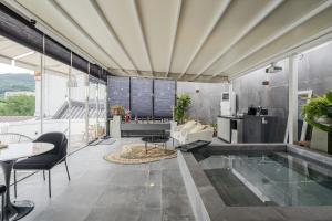 a living room with a pool in the middle at Jeonju Hanok Village, Maison14 in Jeonju