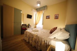 Postel nebo postele na pokoji v ubytování Al Quadrato D'Oro rooms