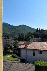 a view of a town with mountains in the background at La mansarda in Gussago