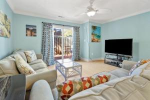 a living room with couches and a flat screen tv at Spacious Home by the Beach 2# in Myrtle Beach
