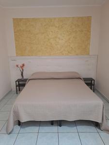 Postel nebo postele na pokoji v ubytování Hotel Lo Smeraldo