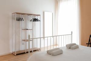 Rúm í herbergi á Three Rooms Alghero