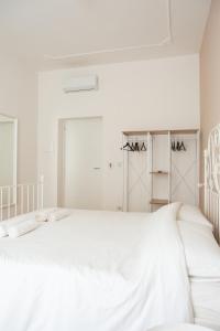 Rúm í herbergi á Three Rooms Alghero