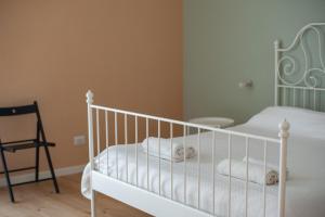 Rúm í herbergi á Three Rooms Alghero