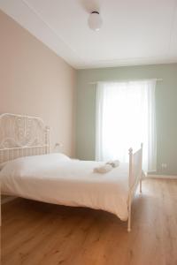 Rúm í herbergi á Three Rooms Alghero