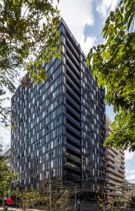 a tall building with a lot of windows at Horacio by Kukun in Mexico City