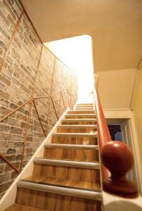 a staircase in a building with a stair case at Truro Central Studios in Truro