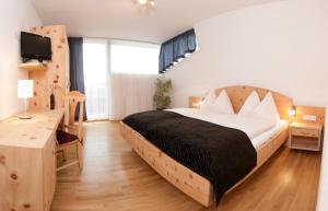 Una cama o camas en una habitación de Hotel Kleißl