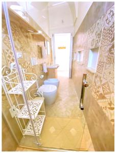 a bathroom with a shower and a toilet in it at Casa Vacanze Patrizia in Botrugno