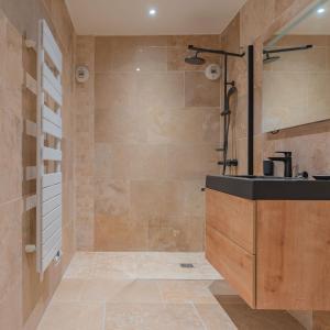 a bathroom with a shower and a sink at Villa vue mer presqu'ile de giens avec piscine in Hyères