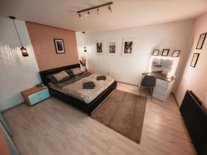 A bed or beds in a room at K22 Apartman