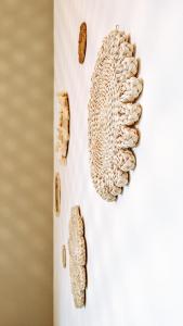 a close up of buttons on a white wall at Casa Monuriki in Rapallo +33 photos