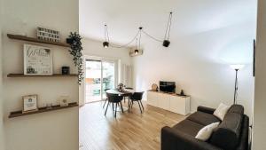 a living room with a couch and a table at Casa Monuriki in Rapallo