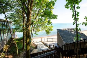 a view of the beach from the balcony of a house at Magnolia Place in New Buffalo