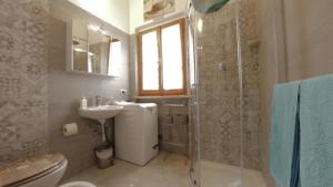 a bathroom with a shower and a sink and a toilet at Conero Guest House in Numana +37 photos