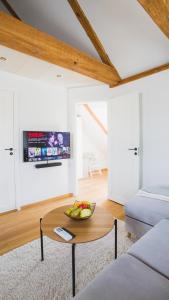 a living room with a bowl of fruit on a table at Jüri tn Apartment B in Võru