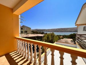 a balcony with a view of the water at Pansion TONY PAG in Pag