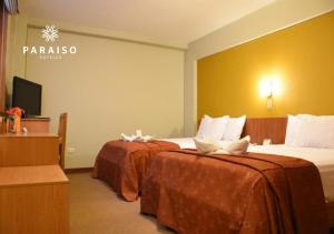 Postel nebo postele na pokoji v ubytování Hoteles Paraiso TRUJILLO