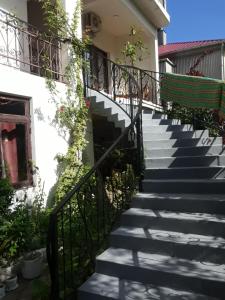 a set of stairs leading up to a building at Guest House Buche on Agmashenebeli 219 in K'obulet'i