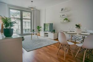 a kitchen and living room with a table and chairs at Kora Home in Santa Cruz