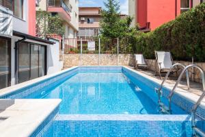 a swimming pool in the middle of a building at Sea House Afrodita II in Nesebar