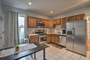 a kitchen with wooden cabinets and stainless steel appliances at Astonishing 4BR Bright *Apt with modern amenities! in Boston