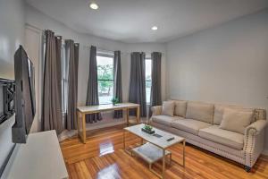 a living room with a couch and a tv at Astonishing 4BR Bright *Apt with modern amenities! in Boston