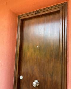 a wooden door with the on it at Apartamento Coblanca 6 in Benidorm
