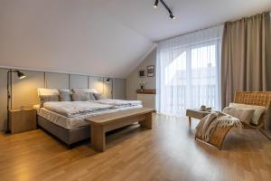 Ένα ή περισσότερα κρεβάτια σε δωμάτιο στο Villa Żywiec