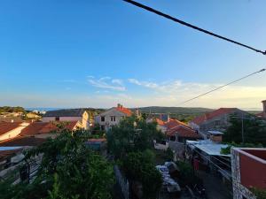 a view of a city with buildings and roofs at Apartman Lila in Čunski +12 photos