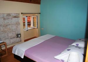 Postel nebo postele na pokoji v ubytování Korčula Sunset apartman