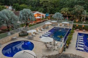 منظر المسبح في Hotel Villa Camila او بالجوار