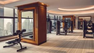 a gym with treadmills and exercise equipment in a building at InterContinental Bangkok by IHG in Bangkok