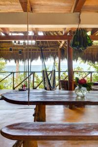 a bench in a room with a view of the ocean at Casitas Maraika in Puerto Vallarta